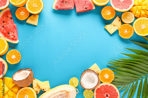 Fototapeta Naklejka Na Ścianę i Meble -  Frame made of ripe fruits on color background