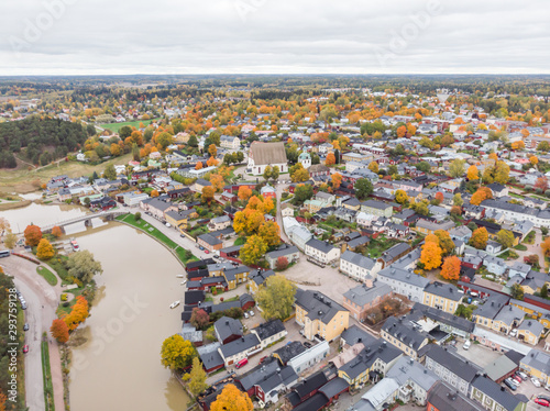 Aerial autumn view of Old town of Porvoo  Finland. Beautiful city landscape with idyllic river Porvoonjoki  old colorful wooden buildings and Porvoo Cathedral.