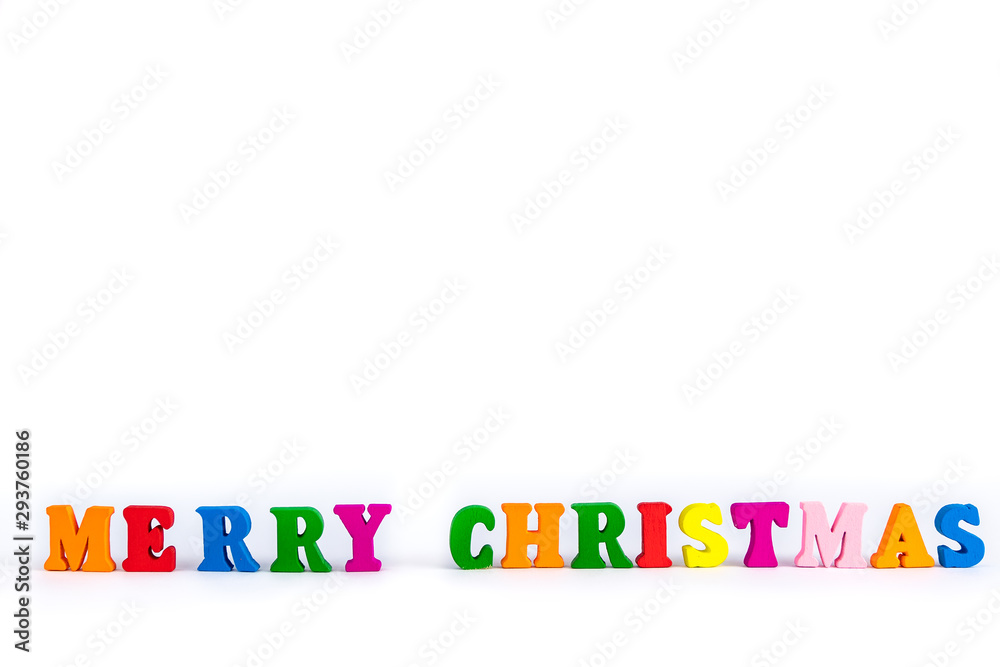 Creative layout of words merry christmas made of wooden multi-colored letters on white background. New Year concept with free space for note and text Creative layout of words merry christmas made of wooden multi-colored letters on white background. New Year concept with free space for note and text