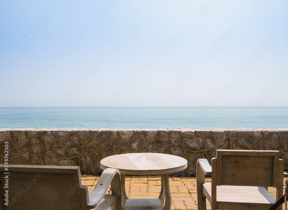 wooden table and chair for outdoor relax by the beach
