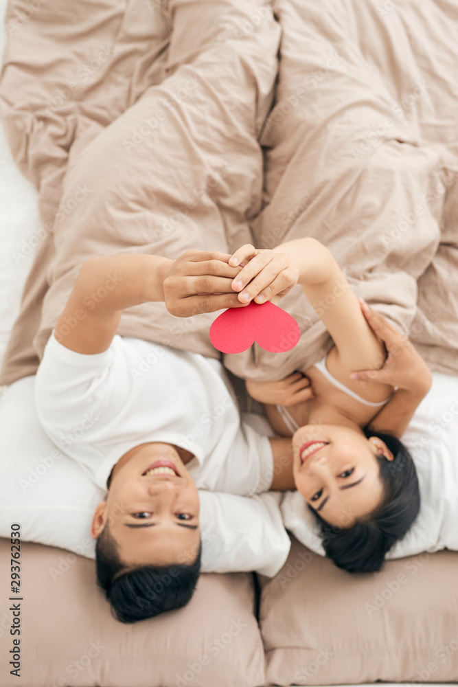 Young loving couple in the bed