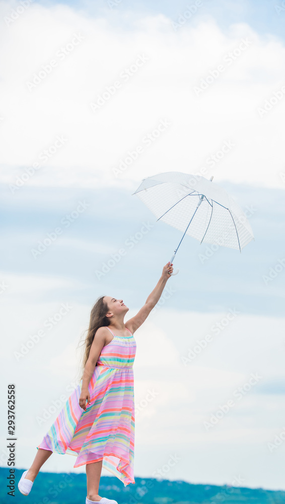Girl with light umbrella. Anti gravitation. Fly drop parachute. Dreaming about first flight. Kid pretending fly. I believe i can fly. Touch sky. tale character. Happy childhood. Feeling light Stock-foto