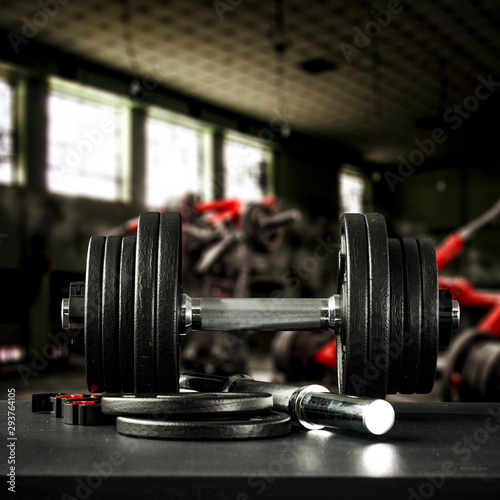 Gym interior and dumbbells on black desk with free space for your decoration.  © magdal3na
