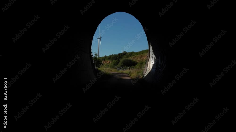 Flying Out Of Tunnel Over Old Limestone Quarry To Wind Turbine Northamptonshire Countryside Aerial 4K Flying Out Of Tunnel Over Old Limestone Quarry To Wind Turbine Northamptonshire Countryside Aerial 4K