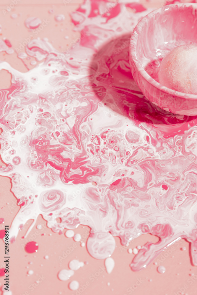 High angle pink and white paint mix
