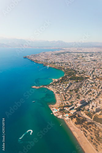 Window view of an airplane on the coast of Antalya with beautiful Taurus Mountains on the horizon, Turkey