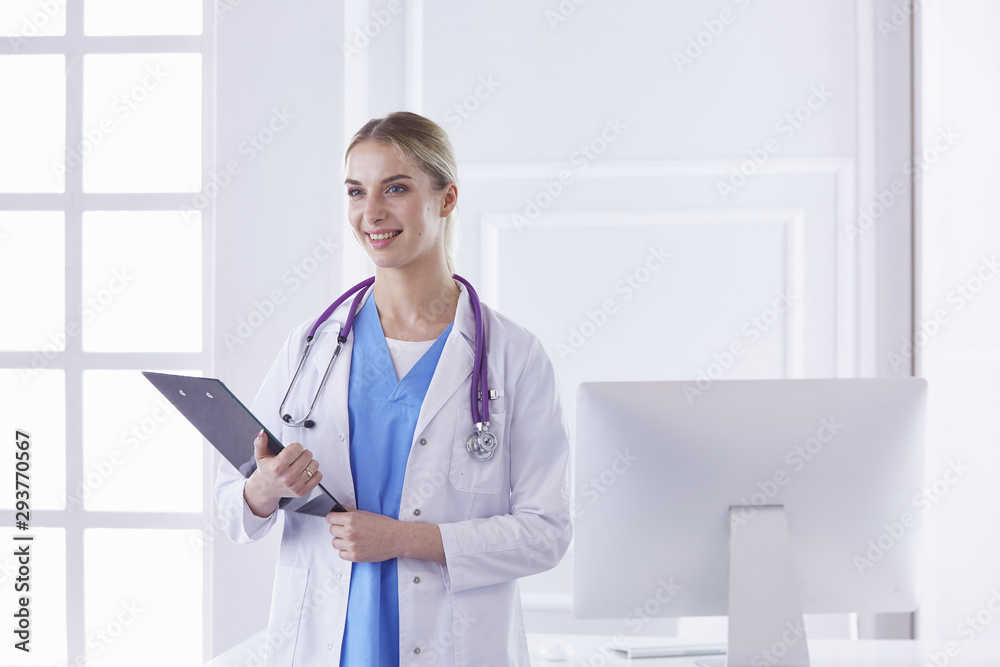 Portrait of a happy smiling young doctor in headset in office Portrait of a happy smiling young doctor in headset in office