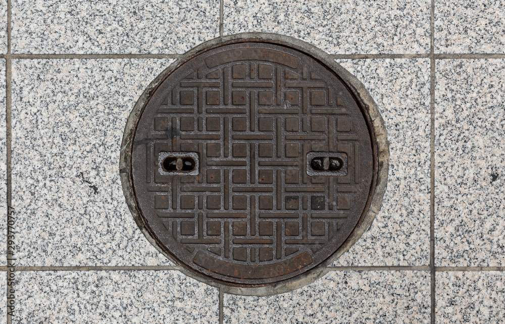 Rusty manhole cap, grunge manhole cover, round