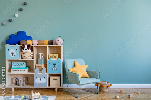Cuadro en lienzo Scandinavian nursery room with wooden cabinet, mint armchair, natural teddy bears and plush animal toys