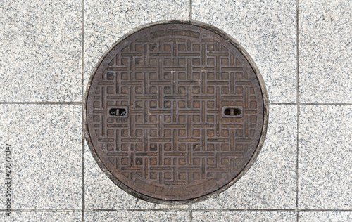 Rusty manhole cap, grunge manhole cover, round