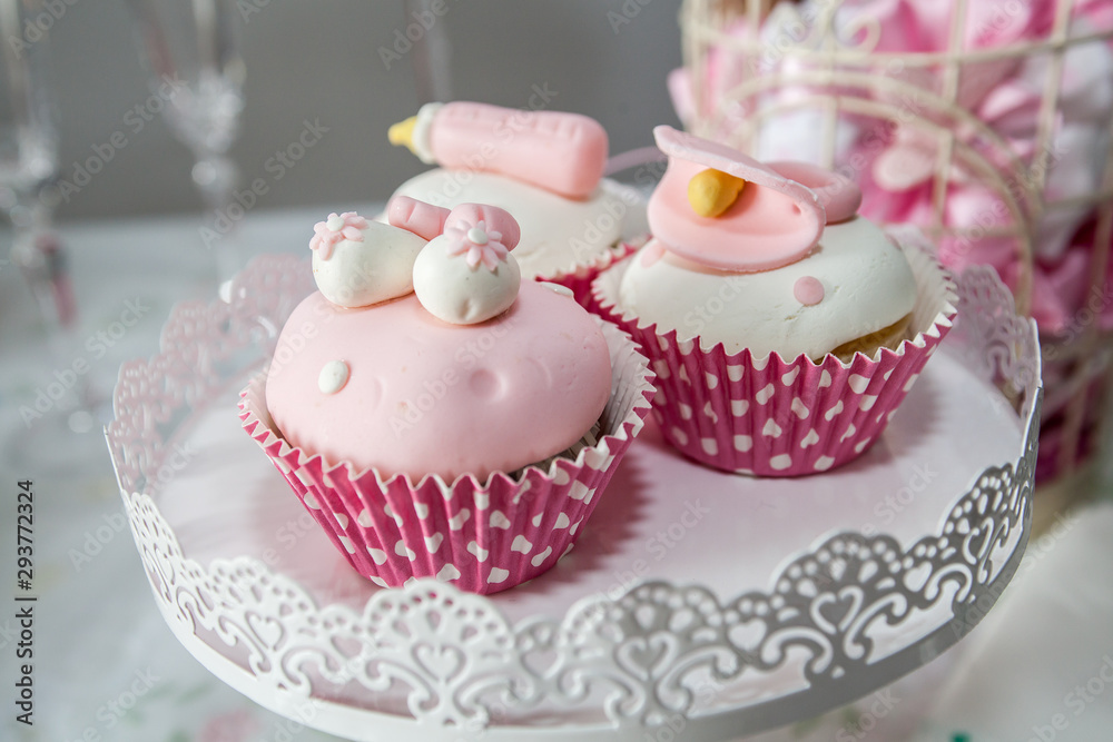 Pink cupcakes for girls, decorated with sugar paste.