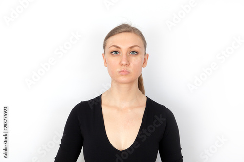 Young pretty woman serious portrait on white background