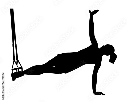 Side view of woman standing in side plank while doing TRX exercises with rope isolated on white.