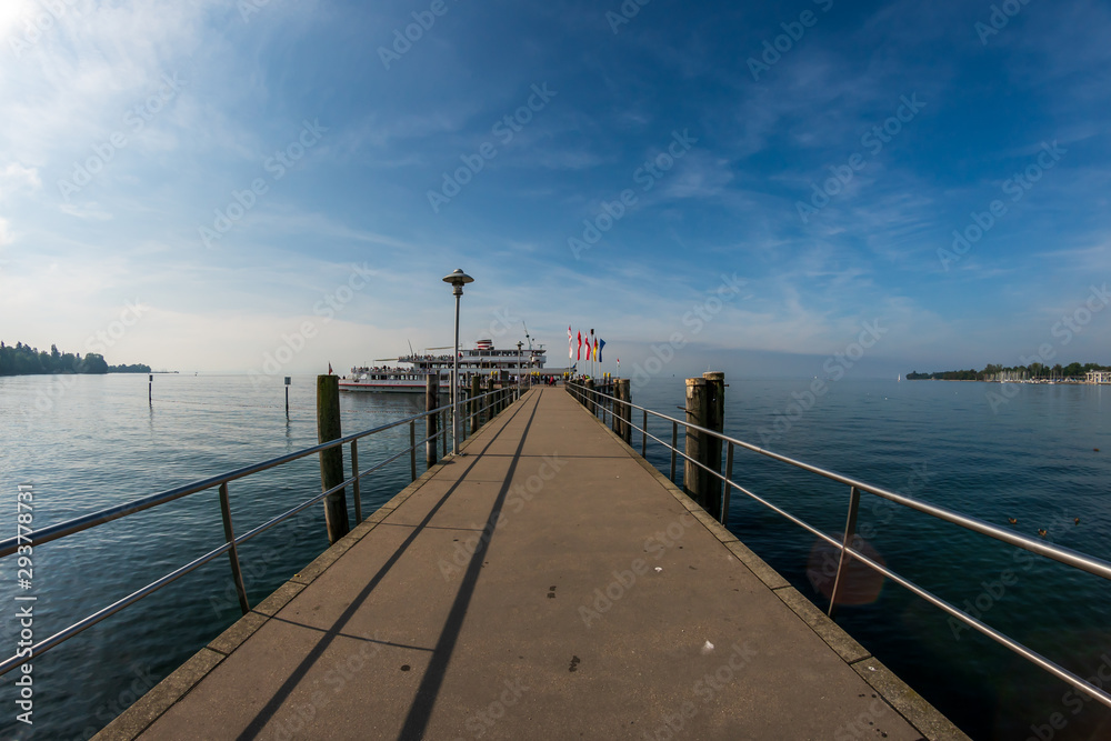 Fototapeta premium A boat at the pier at Kressbronn am Bodensee