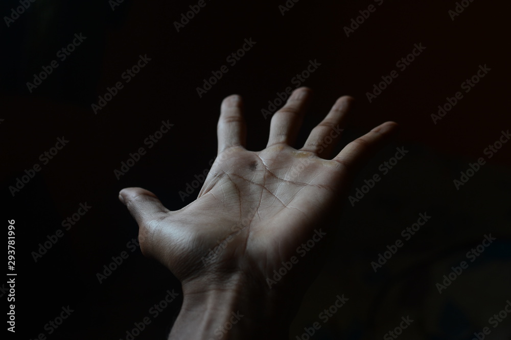 Fototapeta premium human palm with black background