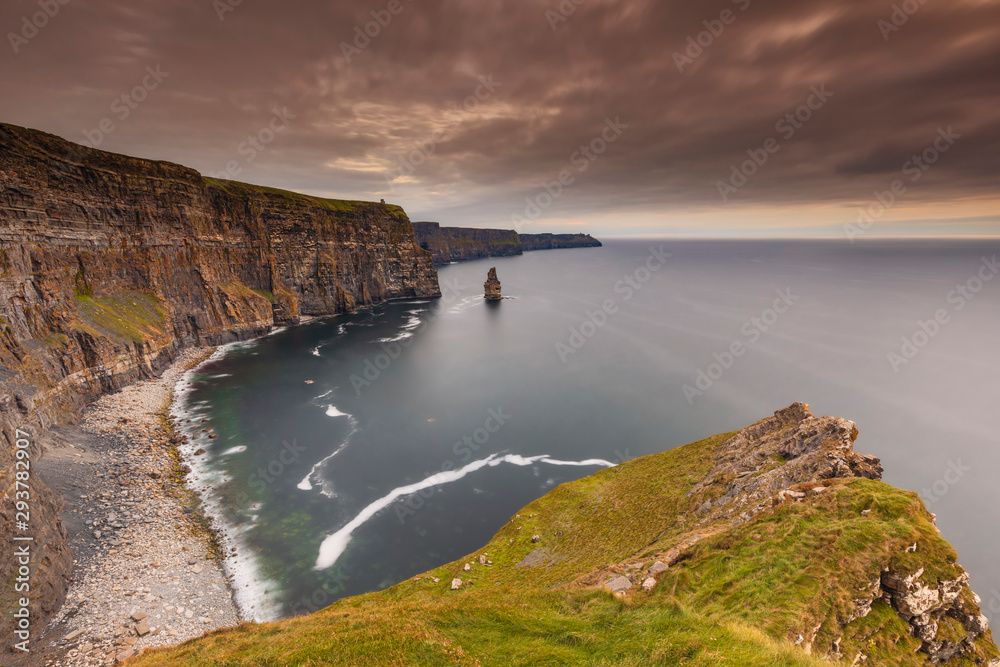 reland countryside tourist attraction in County Clare. The Cliffs of Moher and castle Ireland. Epic Irish Landscape UNESCO Global Geopark the wild atlantic way. Beautiful scenic nature hdr Ireland.