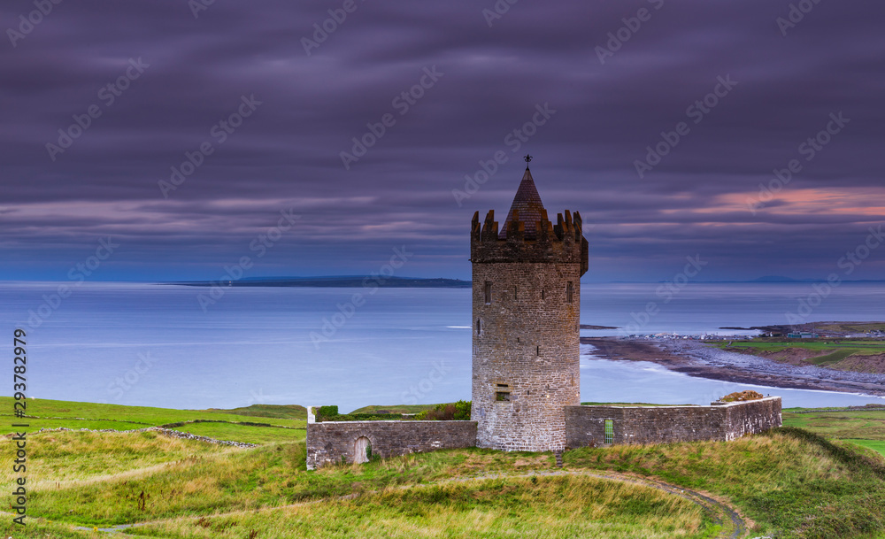 Doonagore castle at sunset, Co. Clare, Ireland Epic sunset landscape the wild atlantic way in Doolin County Clare, Ireland. Beautiful scenery sky cliouds landscape with an old Irish Castle and coastal