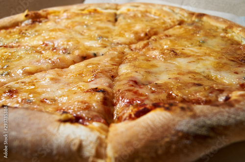 Pizza four cheeses. Tasty hot cheese pizza. photo