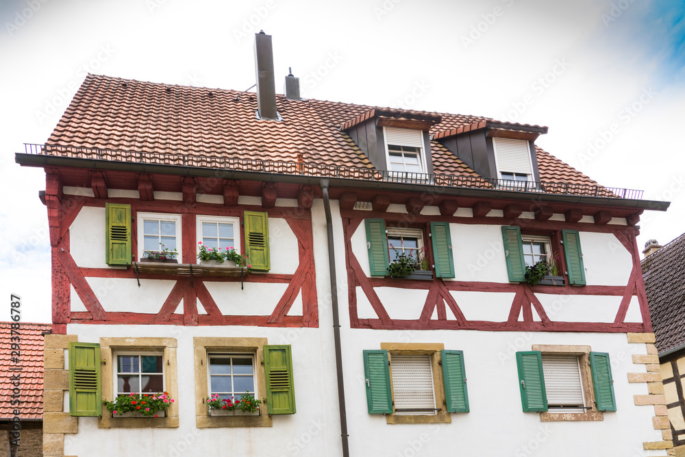 Fototapeta premium white red half timbered houses with shutters and flowers, Eppingen, Germany