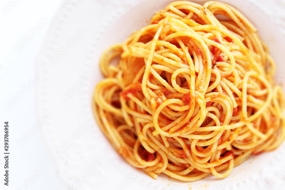 Homemade Italian cuisine, tomato spaghetti on white background Homemade Italian cuisine, tomato spaghetti on white background