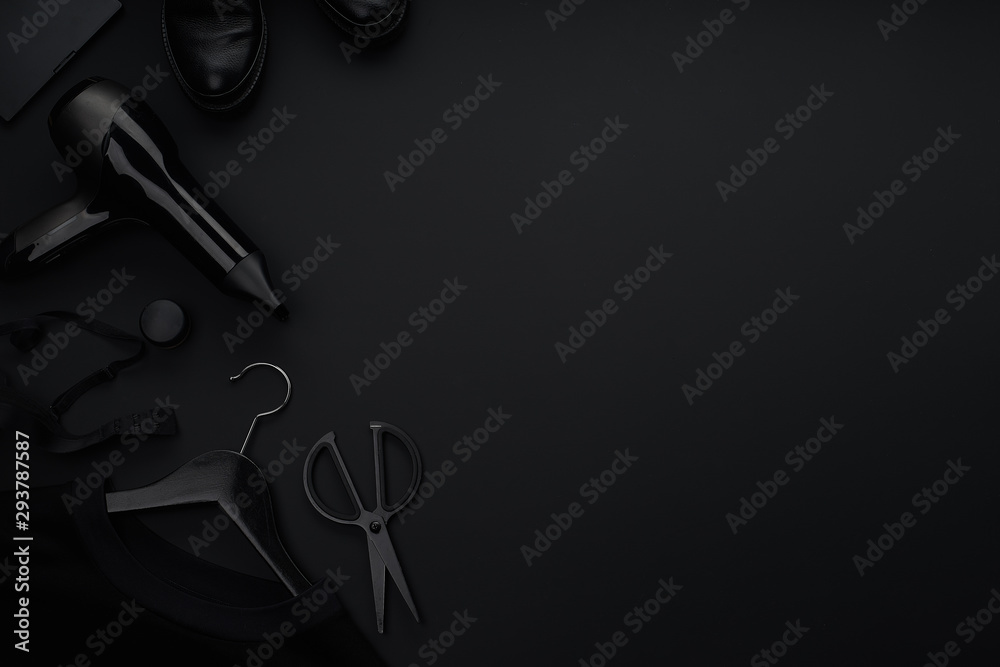 Black monochromatic flatlay on black background. Clothes, accessories and beauty equipment. Black friday sale concept. Copy space Black monochromatic flatlay on black background. Clothes, accessories and beauty equipment. Black friday sale concept. Copy space