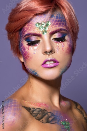 Halloween makeup. Woman in space face art. 