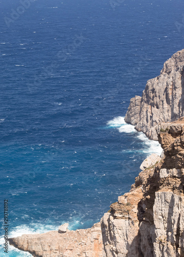 Greece, Folegandros. The historic Kastro in the old capital of the island, the Hora, The town teeters on a sheer cliff face. It was sited there for defence.  A view of the rocks and precipitous cliffs