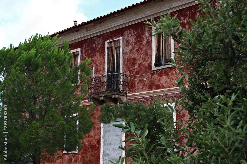 Italy, Sardinia: Red ancient house.