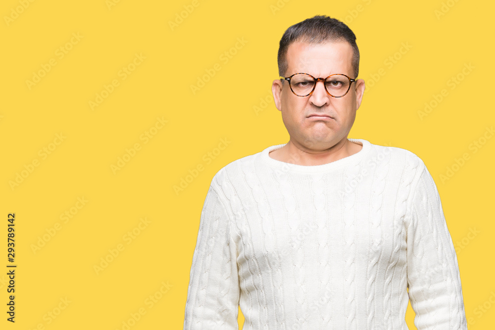 Middle age arab man wearing glasses over isolated background skeptic and nervous, frowning upset because of problem. Negative person. Middle age arab man wearing glasses over isolated background skeptic and nervous, frowning upset because of problem. Negative person.