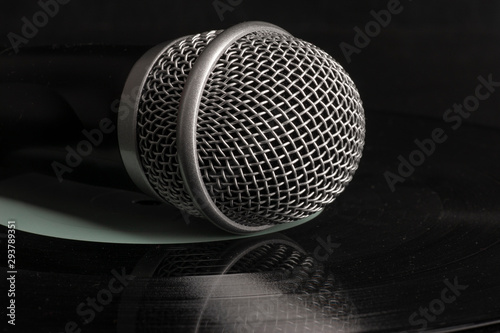 Close up head audio microphone in black background with copy space on the right © biggur