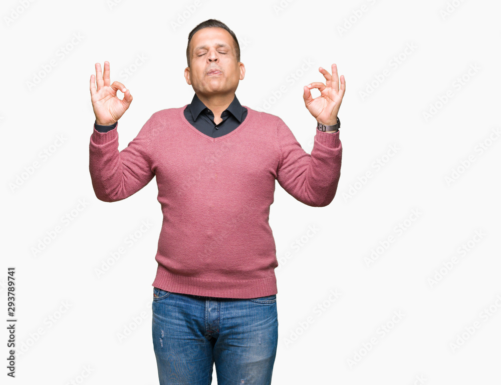 Middle age arab man over isolated background relax and smiling with eyes closed doing meditation gesture with fingers. Yoga concept. Middle age arab man over isolated background relax and smiling with eyes closed doing meditation gesture with fingers. Yoga concept.