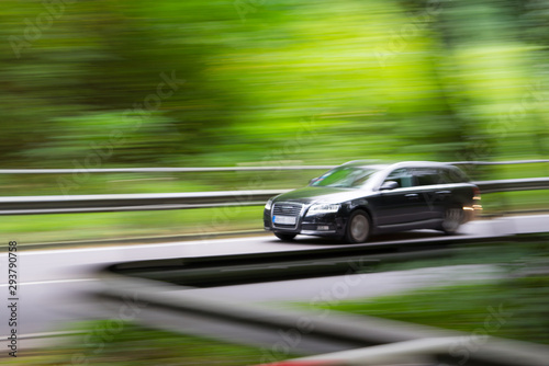 Intentional camera movement of a car in the forest © JGS2584