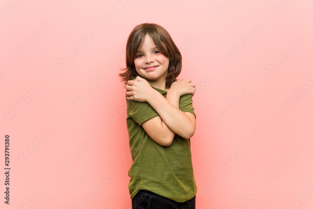 Little boy hugs, smiling carefree and happy. Little boy hugs, smiling carefree and happy.
