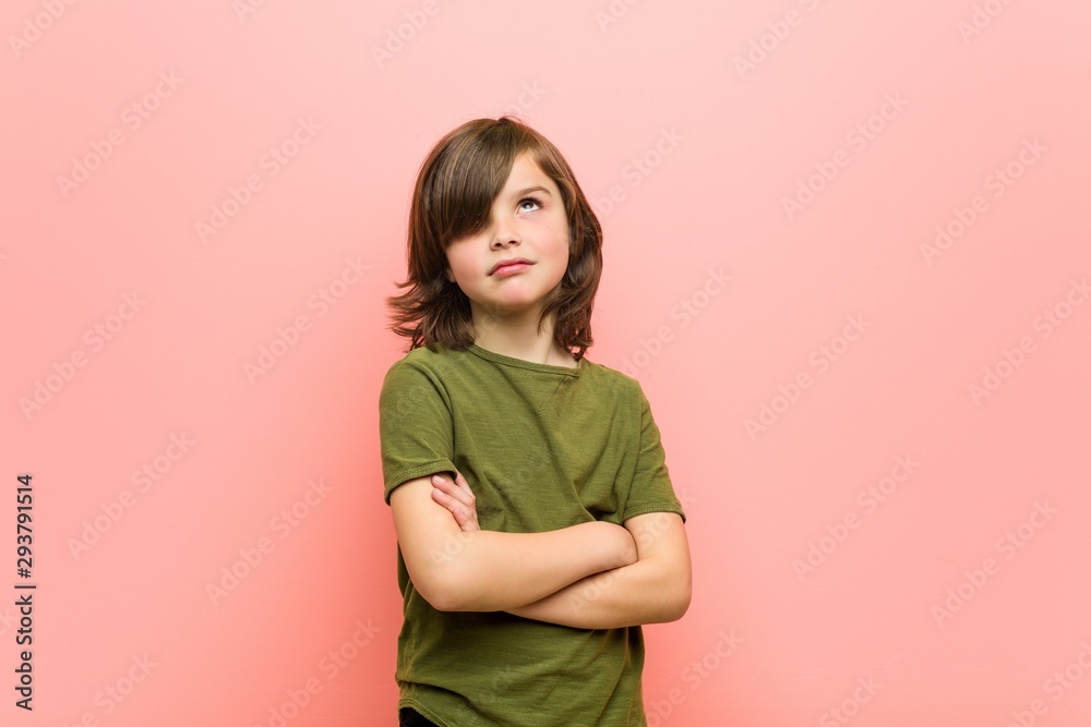 Obraz premium Little boy tired of a repetitive task.