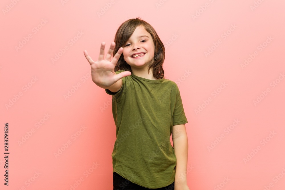 Little boy smiling cheerful showing number five with fingers. Little boy smiling cheerful showing number five with fingers.