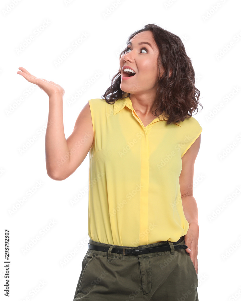 Surprised young woman standing on white background