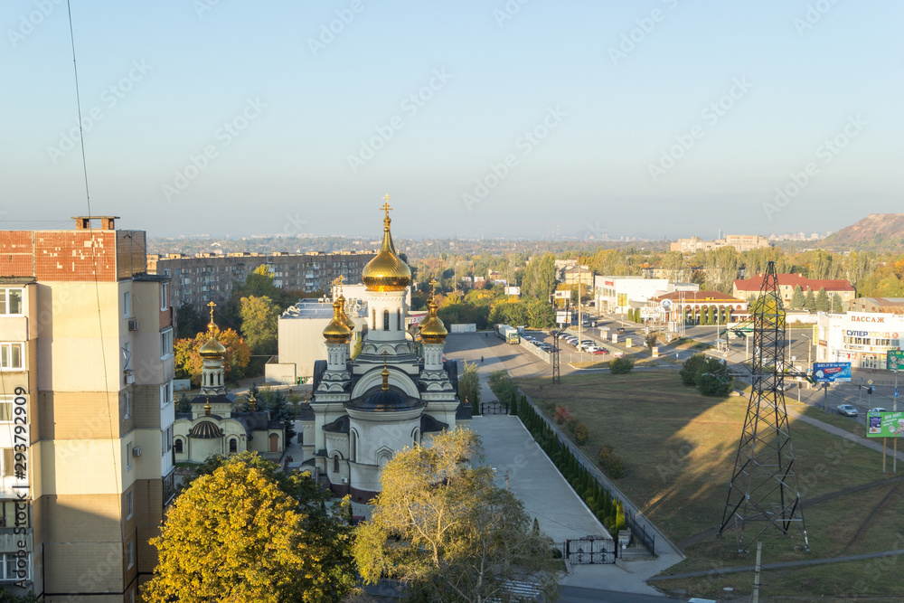 Donetsk, Ukraine, October 3, 2019 year. Trinity Cathedral and temple of St. Blessed Xenia of Petersburg in the Budennovsky district. Sunrise.