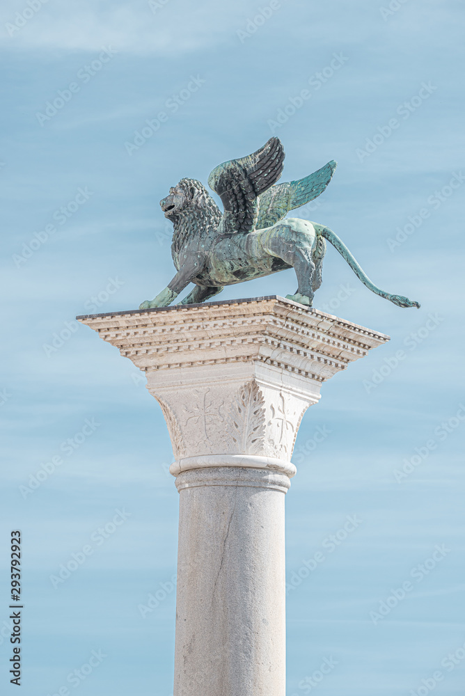Top tower sculpture of winged  lion of Venice at Doge Palace as Venetian symbol, Venice, Italy