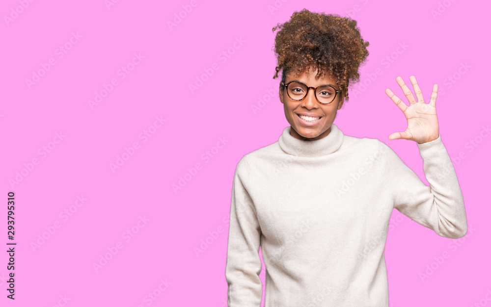 Beautiful young african american woman wearing glasses over isolated background showing and pointing up with fingers number five while smiling confident and happy. Beautiful young african american woman wearing glasses over isolated background showing and pointing up with fingers number five while smiling confident and happy.