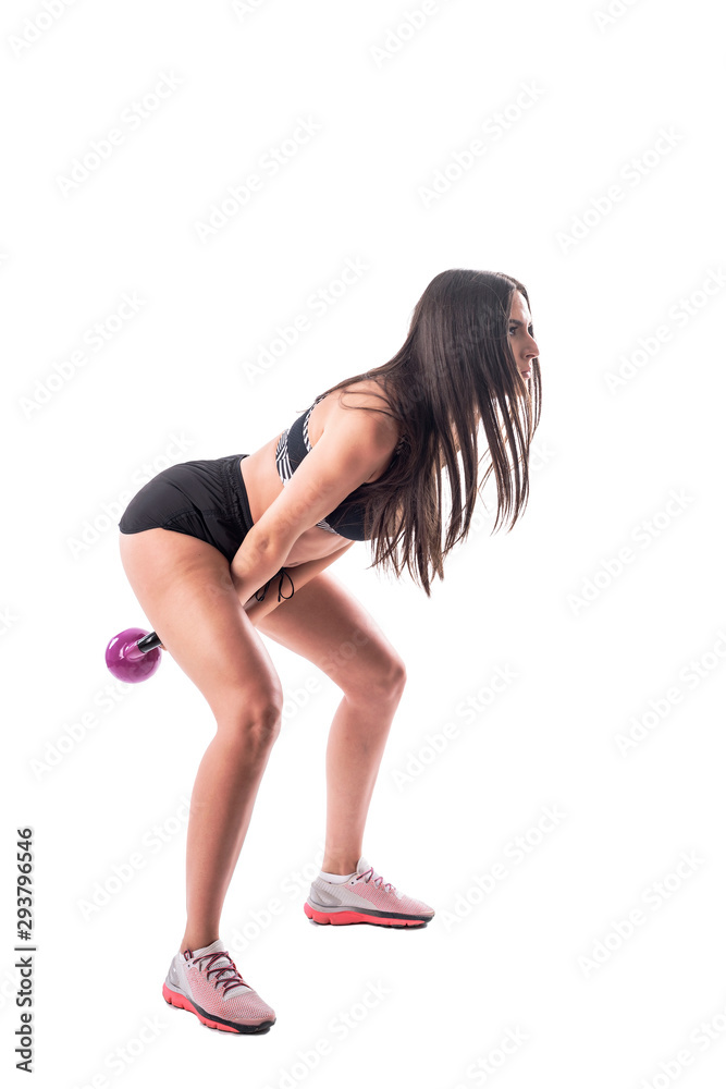 Side view action shot of attractive young athletic woman doing kettlebell workout. Full body isolated on white background. Side view action shot of attractive young athletic woman doing kettlebell workout. Full body isolated on white background.