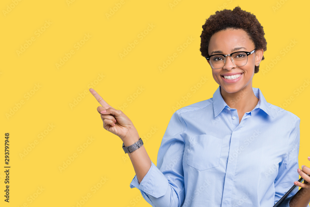 Young african american businesss woman holding clipboard over isolated background very happy pointing with hand and finger to the side Young african american businesss woman holding clipboard over isolated background very happy pointing with hand and finger to the side