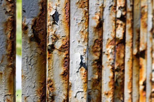 Close up of rusty iron bridge railing.