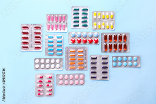 Fotografija Flat lay composition with bunch of different colorful pills in blister packs