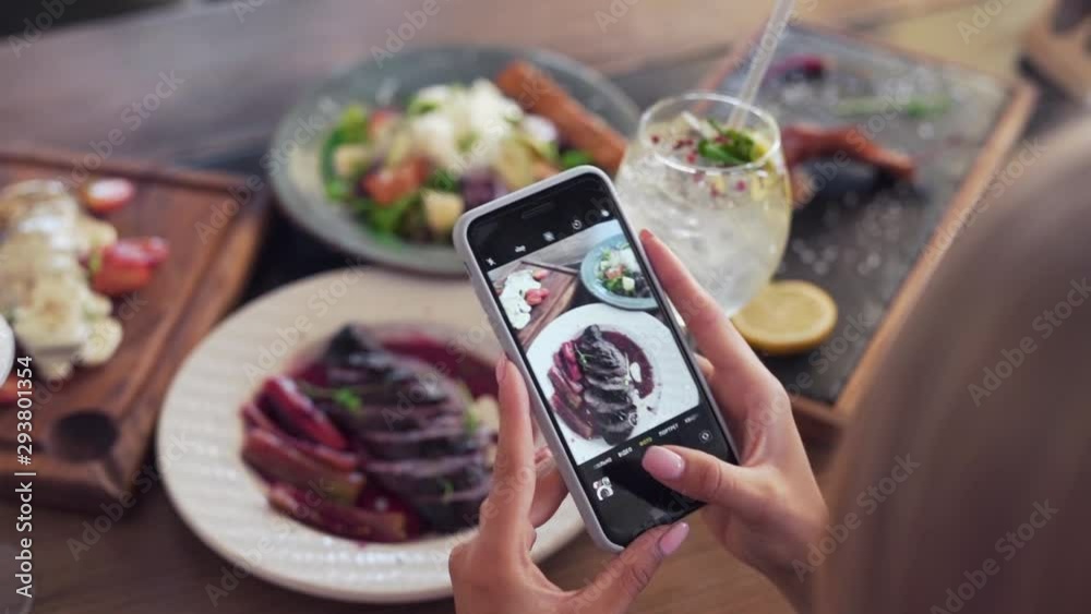 Influencer taking pictures of her food for her social media handle