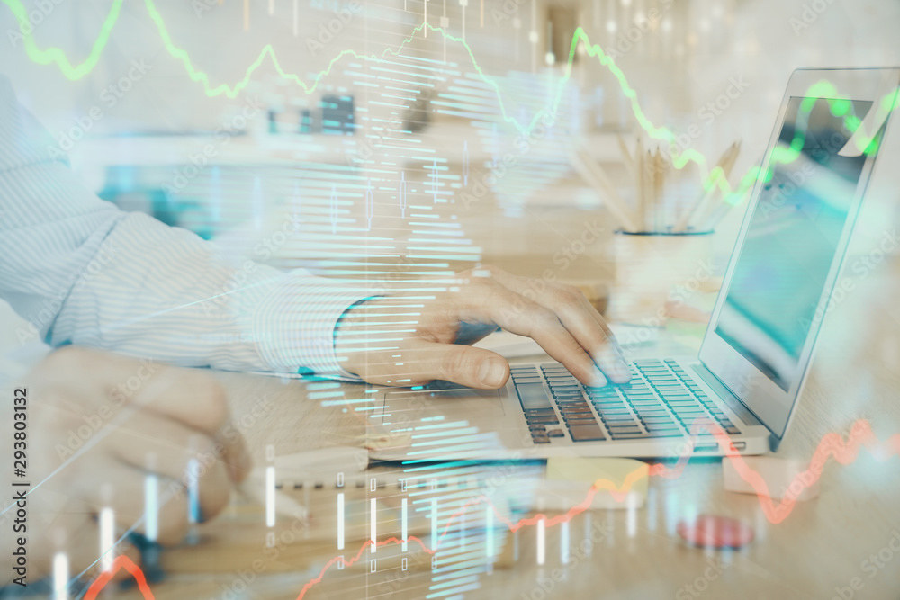 Multi exposure of stock market graph with man working on laptop on background. Concept of financial analysis. Multi exposure of stock market graph with man working on laptop on background. Concept of financial analysis.