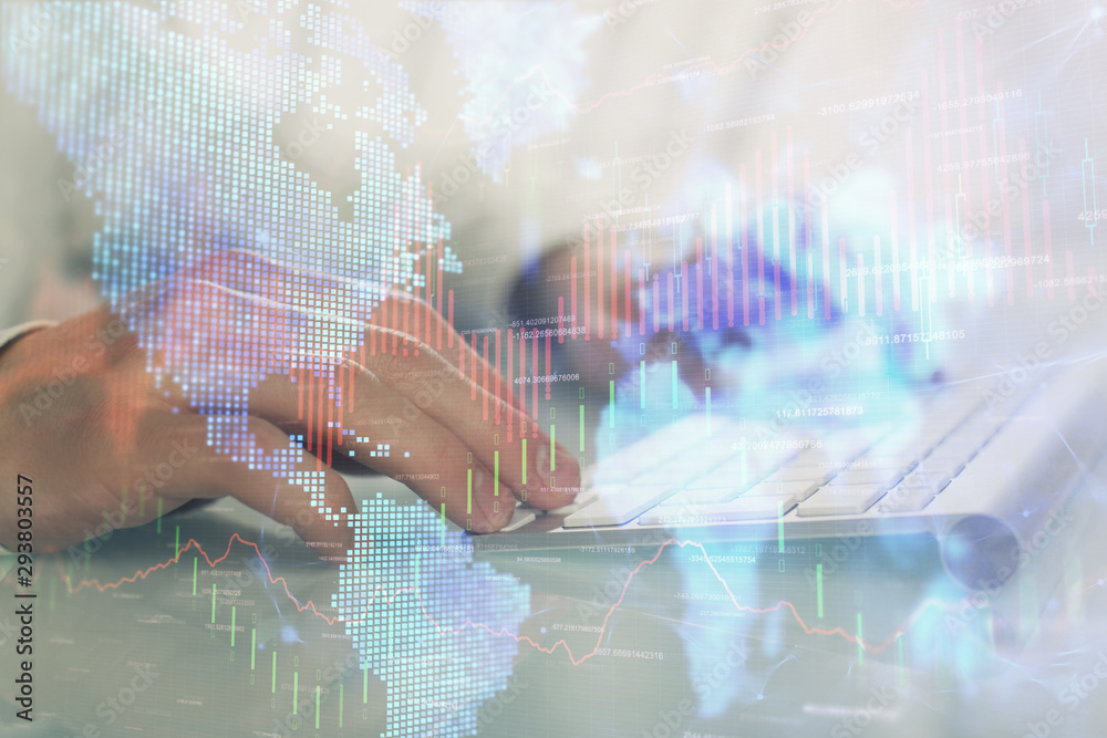 Double exposure of graph with man typing on computer in office on background. Concept of hard work. Double exposure of graph with man typing on computer in office on background. Concept of hard work.