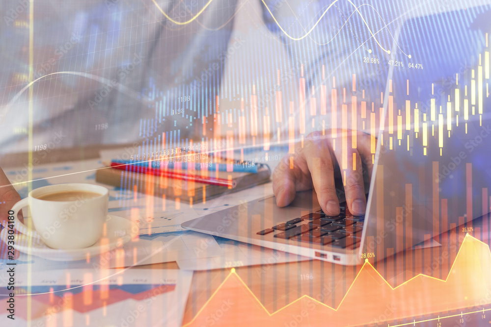 Forex graph with businessman working on computer in office on background. Concept of hardworking. Double exposure. Forex graph with businessman working on computer in office on background. Concept of hardworking. Double exposure.