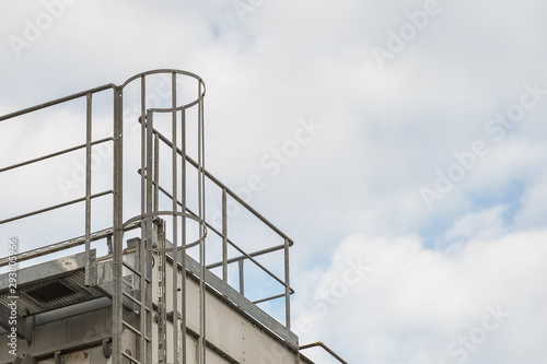 upper part of an industrial building with stairs, railings
