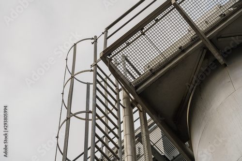 upper part of an industrial building with stairs, railings