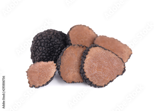 Black truffles isolated on a white background. Fresh sliced truffle. Delicacy exclusive truffle mushroom. Piquant and fragrant French delicacy. Clipping path.